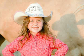 little cowgirl grooming and loving on her quarter horse
