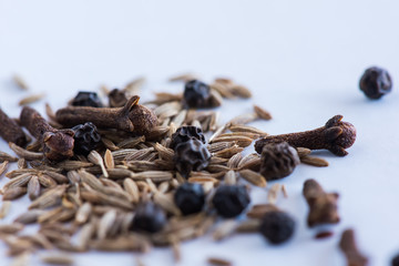 cumin seeds, black pepper, cloves