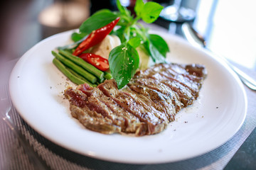 steak in a white dish
