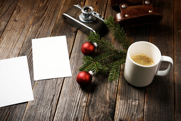 Photos, camera, pine tree branch and cup of coffee