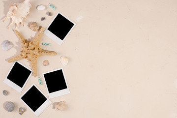 Empty photos on a textural background. The concept of preserving memories. Starfish and shells.