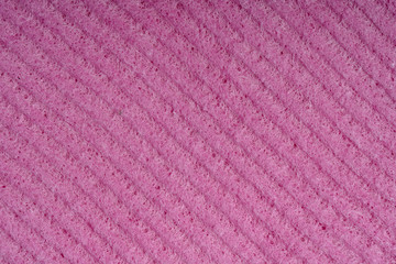 Household cleaning sponges closeup. Sponge detail texture, sponge texture close up background. Cellulose red sponge texture. Pink wire mesh on sponge surface background