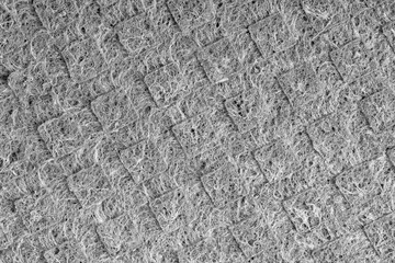 Household cleaning sponges closeup. Sponge detail texture, sponge texture close up background. Cellulose sponge texture. Wire mesh on sponge surface background. Black and white