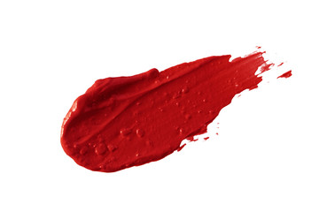 Lipstick smear smudge swatch isolated on white background. Makeup texture. Bright red color cosmetic product brush stroke swipe sample