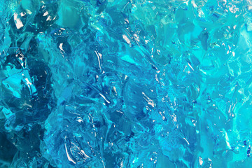 Blue cosmetic gel texture. Bright color jelly closeup background