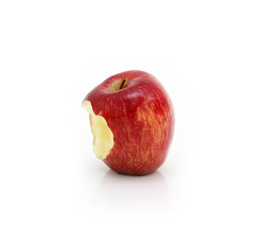 Fototapeta na wymiar Red apple with missing a bite isolated on white background