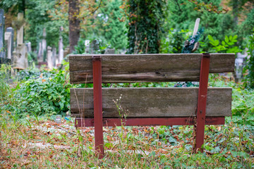 View of empty bench at cemetery 