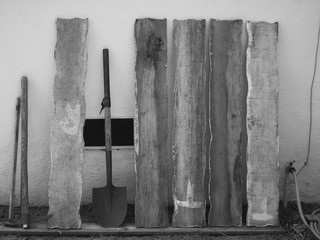 Shovels and Wood on the Wall in Black and White
