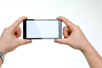 Male hand hoding smartphone isolated on white background. You can insert an image image of your text for the concept or project development of mobile applications and their advertising mobile devices