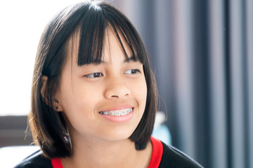 Girl with dental braces smiling and happy