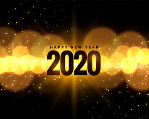 2020 new year celebration background with golden bokeh lights