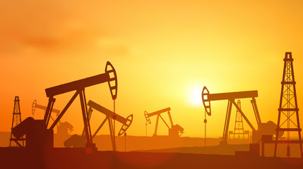  Silhouette Oil pumps at oil field with sunset sky background