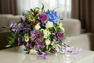  Beautiful flowers in a warm and comfortable interior, a bouquet of flowers on the surface, on the table.