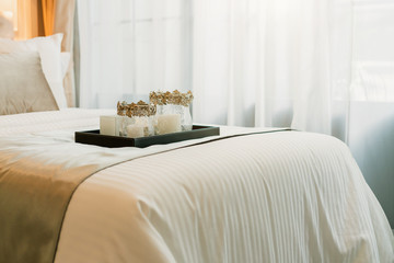 Bed maid-up with clean white pillows and bed sheets in beauty bedroom. Close-up. interior background - obrazy, fototapety, plakaty