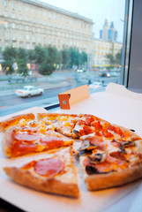 pizza in the cafe near the window