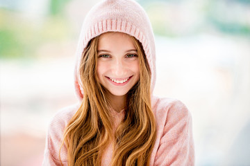 Teenage girl wearing hood