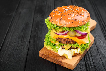 Delicious fresh homemade burger with guacamole sauce.