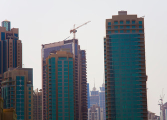 Fototapeta na wymiar modern office building under construction in Dubai city