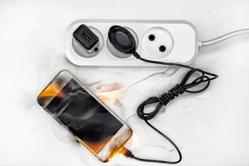 phone on fire connected to the power supply