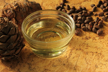 pine nuts and bottle of essential oil