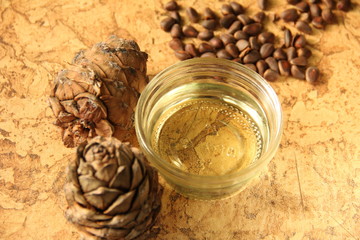 pine nuts and bottle of essential oil