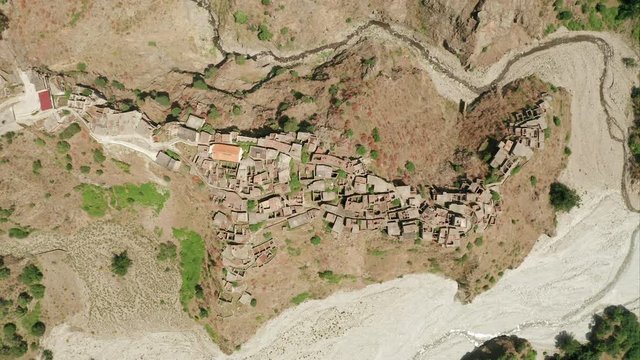 Roghudi Vecchio fascinating Italian ghost town located in Aspromonte mountains in Southern Italy. It was abandoned in 1973 after a series of natural disasters (flood). Top down aerial view.