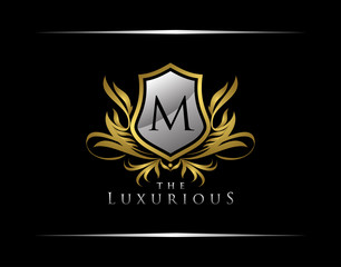 Classy Shield Logo with M Letter in Royal Badge Vector Logo Template Used for hotel, restaurant, boutique, jewellery invitation, business card etc