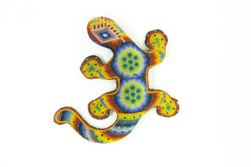 beaded ceramic chameleon on white background