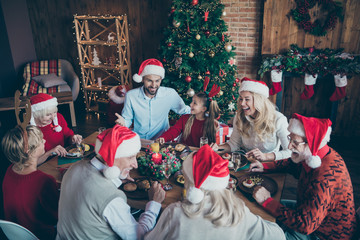 Merry christmas large family reunion gathering meeting sit table have x-mas feast father in santa...