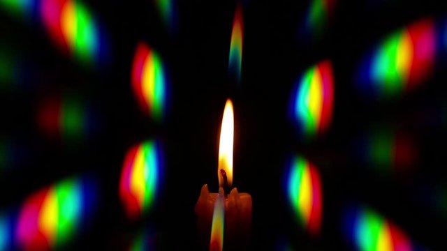 The diffraction of light emitted by the burning candle, obtained by thin phase grating