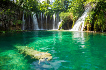 Pure fresh water rushing into an azure coloured lake at the Plitvice Lakes National Park, Plitvička Jezera, Croatia