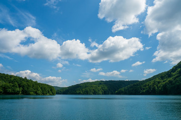 Fototapeta na wymiar Scenic view of the azure coloured Lake Kozjak surrounded by densely wooded hills at Plitvice Lakes National Park in Croatia