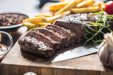 Beef Rib Eye steak with roasted potatoes bbq sauce garlic mushrooms and spices.