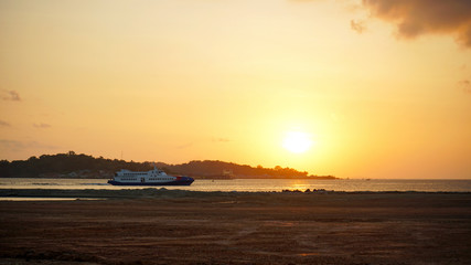 boat at beautiful golden sunset
