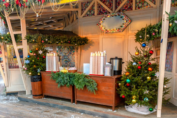 Fototapeta na wymiar Pavilions offering mulled wine at traditional Christmas market on