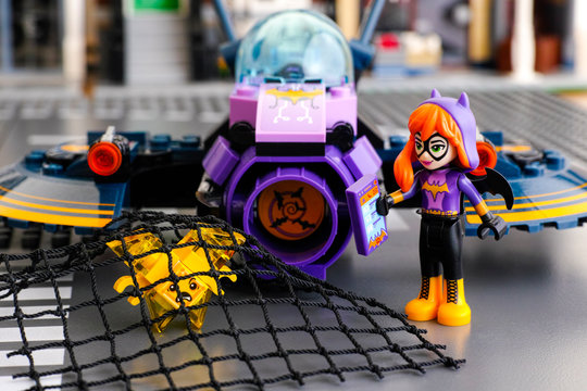 Tambov, Russian Federation - March 04, 2017 Lego DC Super Hero Girls world. Batgirl mini-doll and her Batjet caught in net yellow Kryptomite. Studio shot.