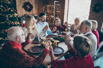 Nice careful affectionate friendly childhood idyllic peaceful calm big full family spending December tradition eating breakfast hold hands pray modern loft brick style interior decorated house