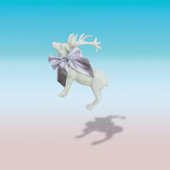 Christmas flying reindeer concept with shadow and gradient pastel background. Minimal