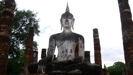 Fototapeta na wymiar Buddha statues at Wat Mahathat, Sukhothai Historical Park is the UNESCO world heritage
