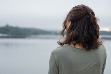 Asian woman back view river