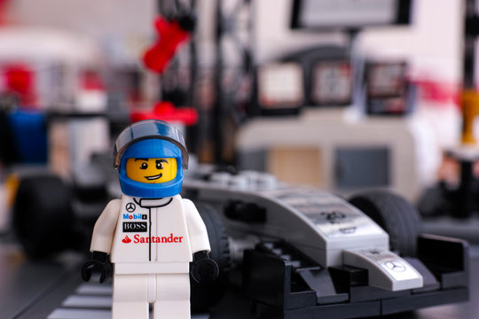 Tambov, Russian Federation - June 24, 2015: Lego McLaren Mercedes Driver Minifigure Standing In Front Of His Car By Lego Speed Champions. Studio Shot.