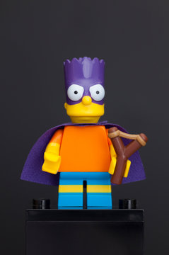 Tambov, Russian Federation - June 08, 2015 Lego Bart Simpson minifigure as a Bartman with slingshot on black background. 