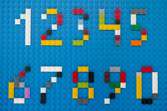 Tambov, Russian Federation - February 14, 2015 Lego custom numbers on Lego blue baseplate background. Studio shot.