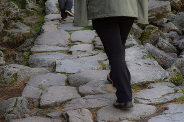 young woman hiking in the mountains