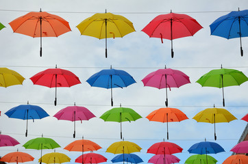 Fototapeta na wymiar Bunch of Colorful Umbrellas Decorating the Sky