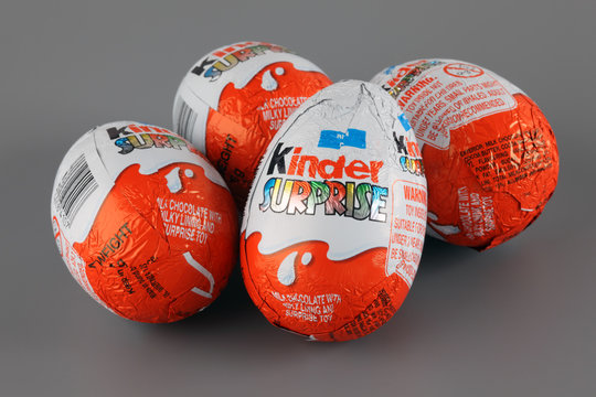 Tambov, Russian Federation - April 04, 2013 Four Kinder Surprise Eggs on grey background. Kinder Surprise manufactured by Italian company Ferrero.