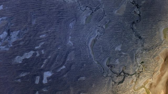Dry land sand dunes in Simpson desert Australia, sunrise animation satellite view. Contains public domain image by Nasa