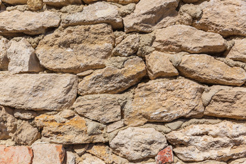 An ancient masonry from which an antique wall having been made