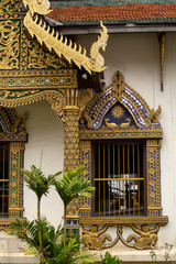 Fototapeta na wymiar Ornate windows in halll at Wat Chiang Man, Chiang Mai, Thailand