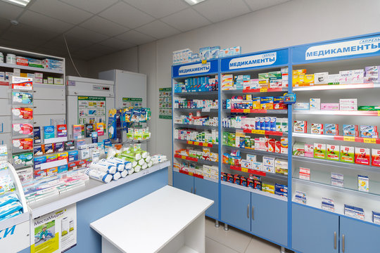 Adygea, Russia - June 6, 2018:  Interior of modern pharmacy with medicines, cosmetics and products for healthcare on shelves  in Russia
